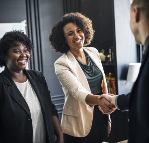 Management shaking hands in a transition period