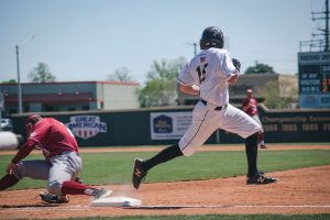 Baseball player crossing base