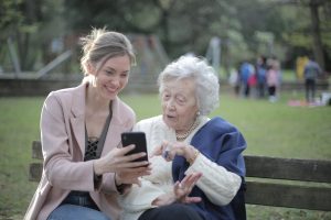 Volunteer showing a Booster Club Crowdfunding Fundraiser to a supporter