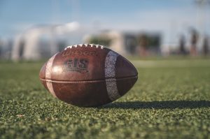 Football booster clubs supporting the team with new equipment like footballs.