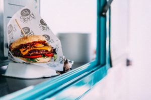 Burger ready to go at a concession stand