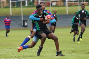 Rugby players in the middle of a match.