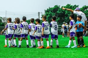 Soccer coach directing the team