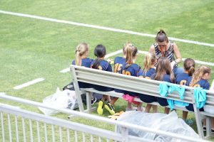 Girls soccer team on the bench.