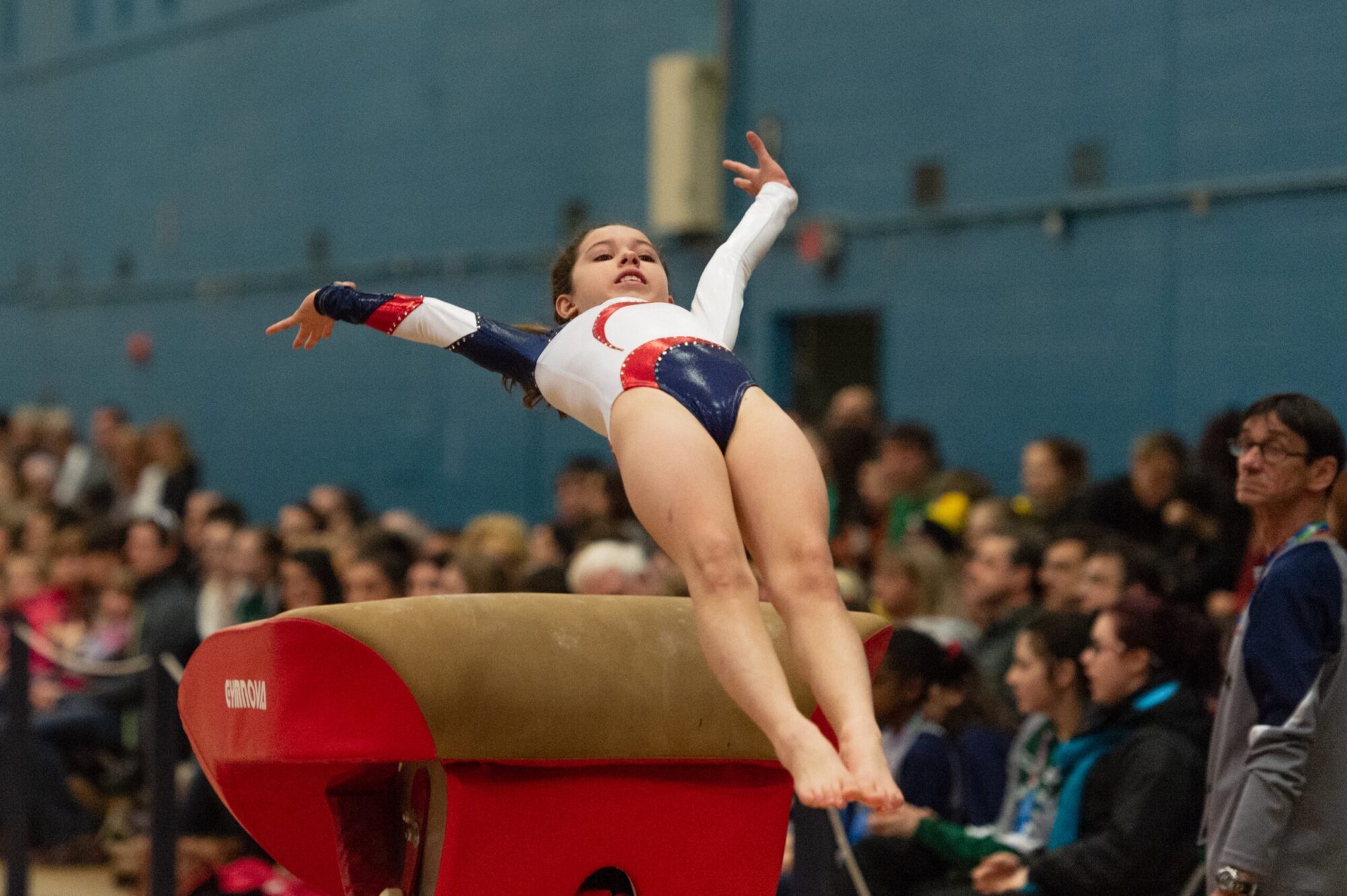 Gymnast competing at event supported by her gymnastics booster club