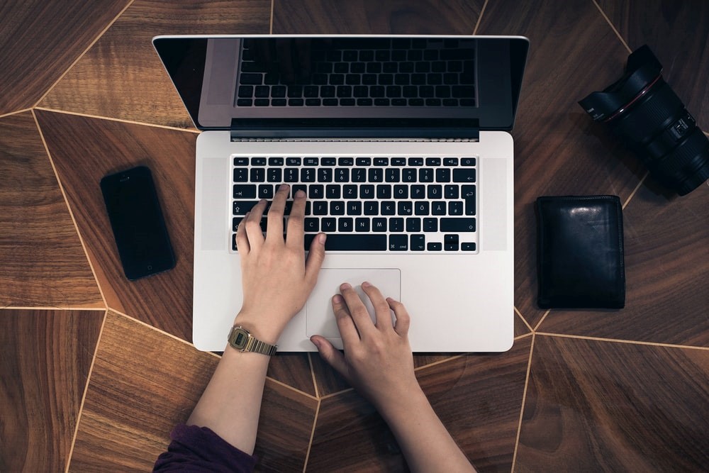 A person searching on their laptop.